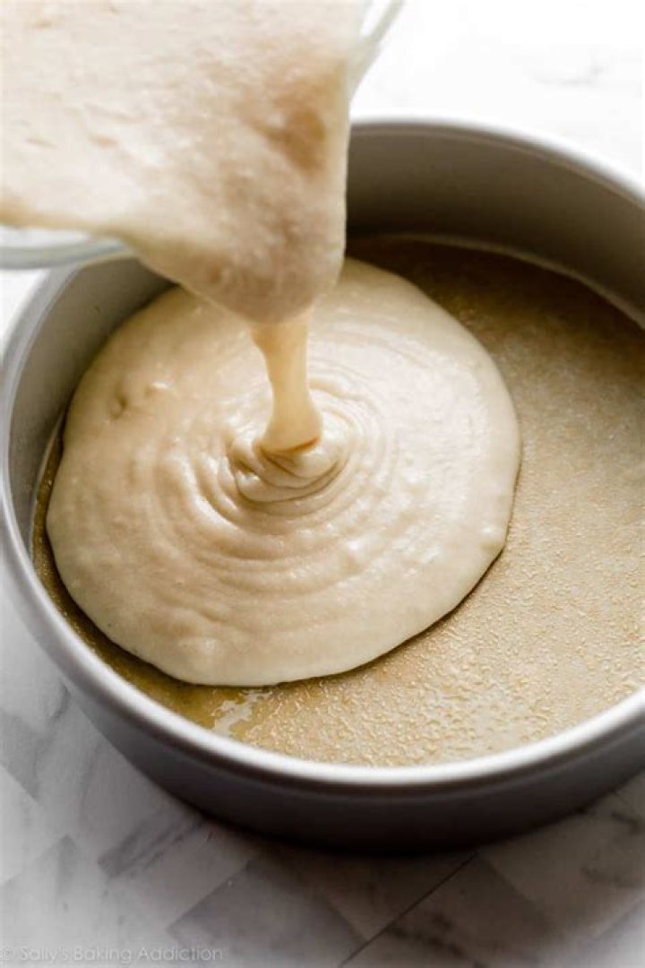 Pumpkin cake batter in a glass bowl.