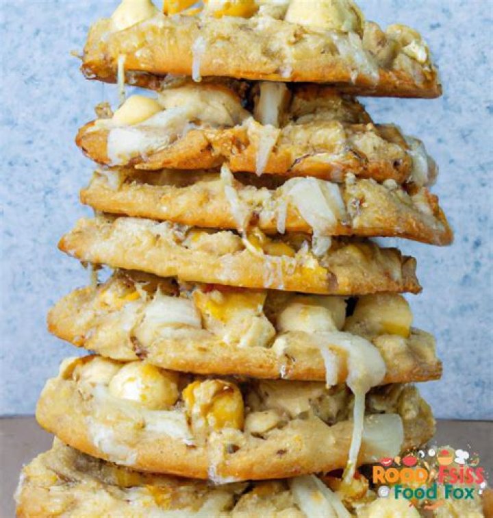 Stack of white chocolate macadamia nut cookies.